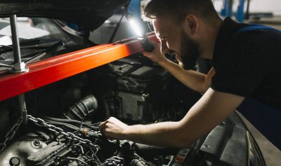 auto-mechanic-looking-car-s-engine (1) auto-mechanic-looking-car-s-engine (1)